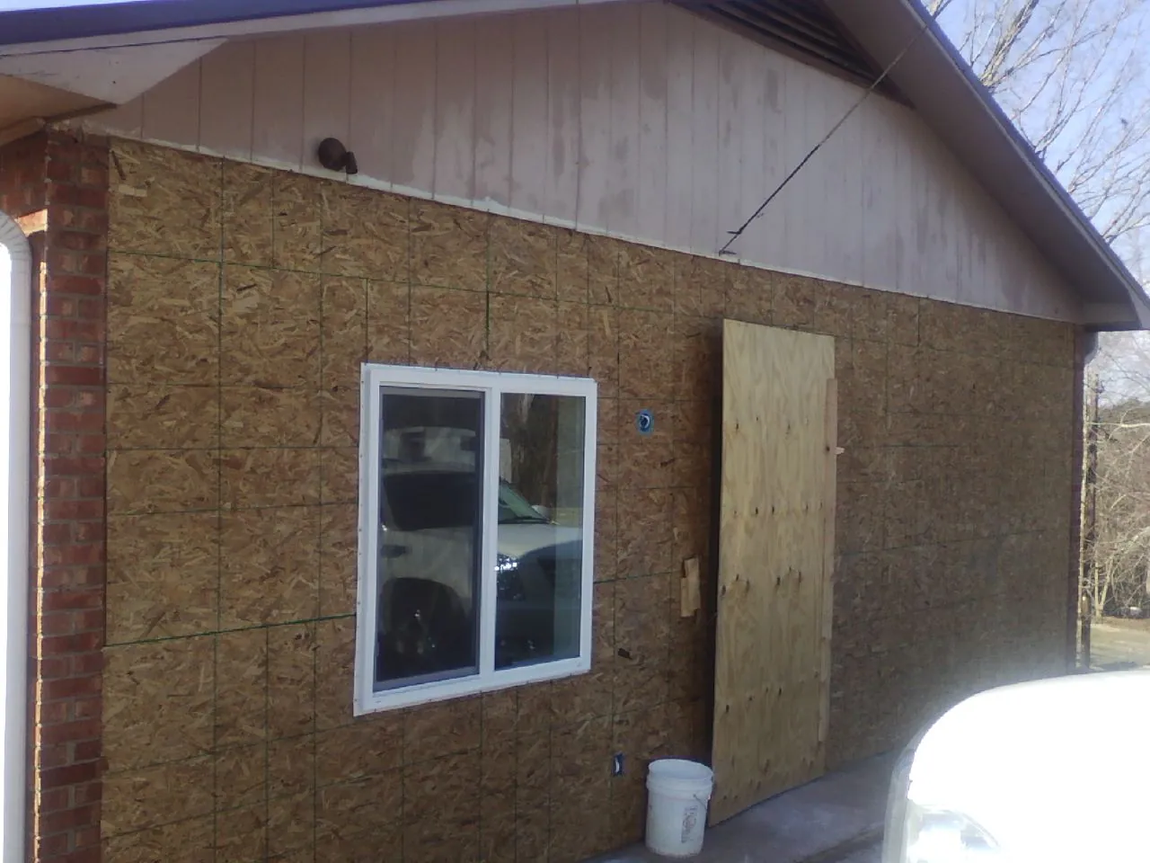 OSB sheathing on a garage addition wall before siding in New Vienna